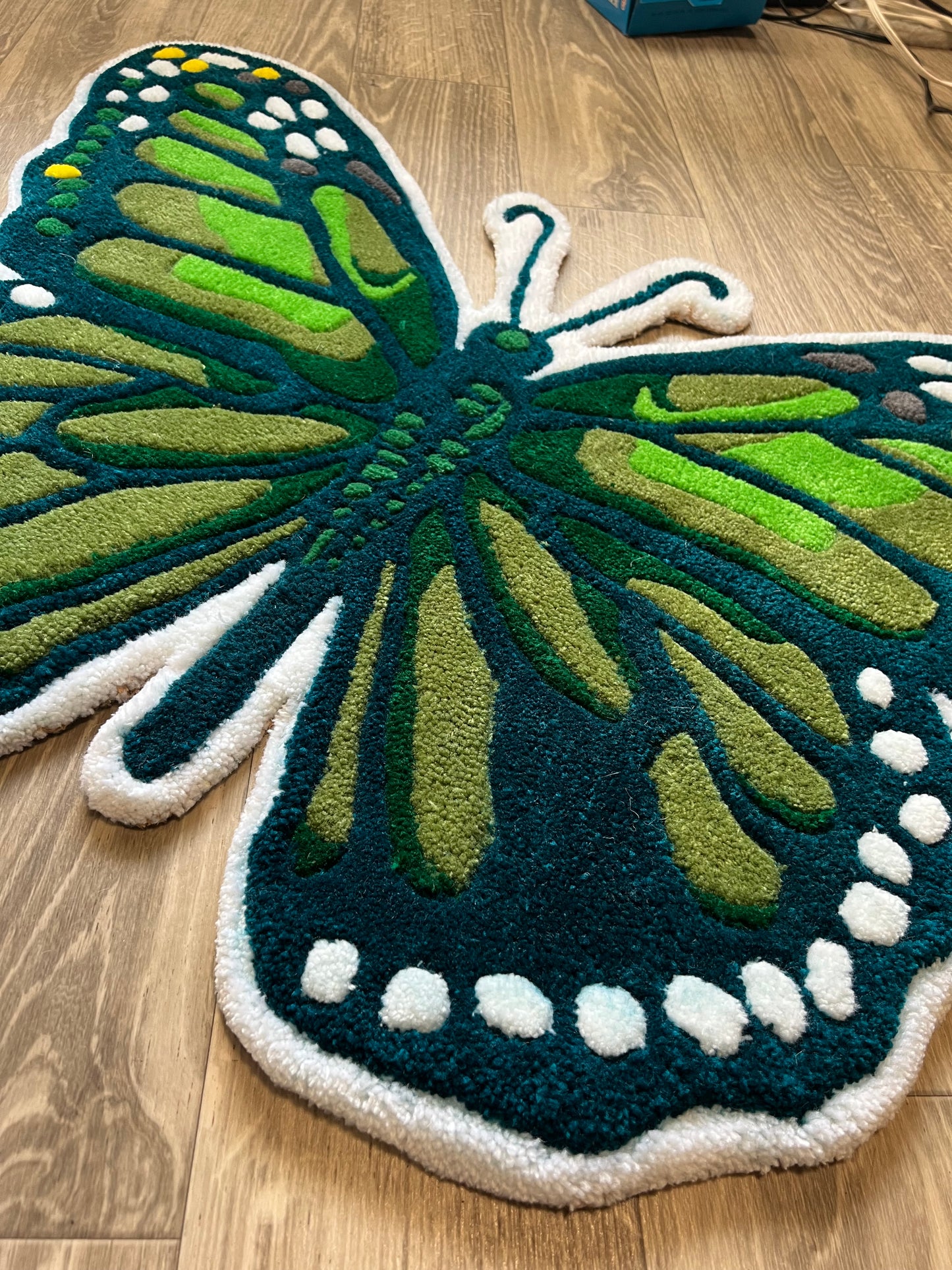 Tufted butterfly rug